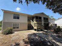 The exterior of a two-story home with patios and wood stairs is beautifully designed at 1600 Big Tree Rd # L1, South Daytona, FL 32119