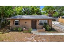 Charming single-story home featuring a cozy front porch and natural landscaping at 1718 Maryland Ave, Ormond Beach, FL 32174