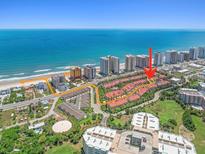 Stunning aerial view of townhomes at the oceans with beach access and nearby amenities at 2961 Oceans Trce, Daytona Beach Shores, FL 32118