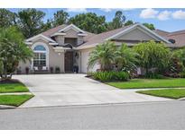 Charming single-story home featuring lush landscaping and a welcoming front entrance at 3378 Leonardo Ln, New Smyrna Beach, FL 32168