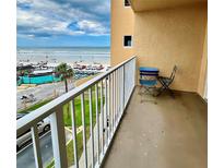 Balcony with ocean view and seating offering a relaxing outdoor space at 421 S Atlantic Ave # 407, New Smyrna Beach, FL 32169