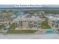 Beachside condominium features a pool, hot tub, lawn, and ocean views at 4575 S Atlantic Ave # 6203, Ponce Inlet, FL 32127