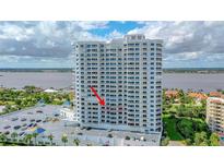 Condo building featuring many stories, multiple balconies, and on-site parking at 2 Oceans West Blvd # 608, Daytona Beach Shores, FL 32118