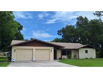 Charming single-story home featuring a two-car garage and well-maintained landscaping at 2029 Willow Oak Dr, Edgewater, FL 32141