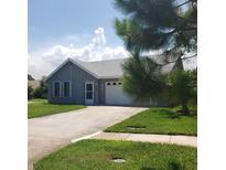 Charming single-story home with well-maintained lawn, garage and freshly painted exterior at 714 Fox Tail Ct, New Smyrna Beach, FL 32168