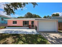 Charming single-story home featuring a well-maintained lawn and a single-car garage at 805 E 18Th Ave, New Smyrna Beach, FL 32169