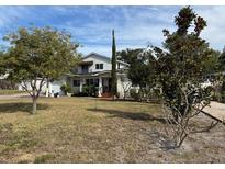 Two-story house with a large yard and mature trees at 3115 Albert St, Orlando, FL 32806