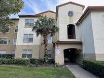 Building exterior showcasing inviting entryway and landscaping at 829 Camargo Way # 212, Altamonte Springs, FL 32714