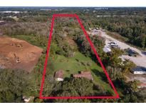 Aerial view of property showing house and surrounding land at 12 Lee St, Ocoee, FL 34761