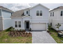 Charming two-story home features a two-car garage and well-maintained landscaping at 4189 Lana Ave, Davenport, FL 33897