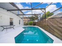 Inviting screened pool with a spacious deck at 608 Abaco Ct, Kissimmee, FL 34746