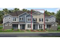 Charming two-story townhome featuring a welcoming entrance and well-manicured landscaping at 1463 Alston Bay Blvd, Apopka, FL 32703