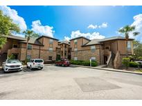 Beautiful condo building with meticulously kept grounds under a blue sky is a desirable place to live at 478 N Pin Oak Pl # 308, Longwood, FL 32779