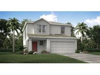 Two-story house with gray siding, red door, and two-car garage at 512 Peace Dr, Poinciana, FL 34759