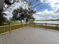 Enjoy lake views from this spacious deck, perfect for outdoor relaxation and entertaining at 4808 Anderson Rd, Orlando, FL 32812