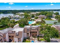 Aerial view of condo community with pool, tennis court, and lake access at 206 Orienta Point St # 206, Altamonte Springs, FL 32701