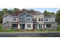 Charming two-story townhome featuring a cozy front porch and well-manicured landscaping at 1459 Alston Bay Blvd, Apopka, FL 32703
