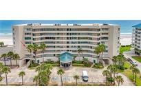 Oceanfront building showcasing a balcony on the third floor at 4631 S Atlantic Ave # 8301, Ponce Inlet, FL 32127
