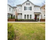 Two-story house with gray siding, black shutters, and a manicured lawn at 790 Candlebrush Ln, Lake Mary, FL 32746