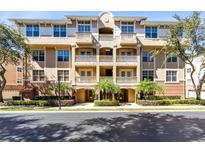 Beautiful multi-story condo building with balconies and lush landscaping at 913 Lotus Vista Dr # 101, Altamonte Springs, FL 32714