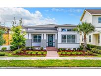 Charming single-story home featuring a neatly landscaped front yard and inviting brick pathway at 8851 Sperry St, Orlando, FL 32827