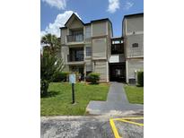 Inviting condo building with private balconies and well-maintained landscaping at 1932 Lake Atriums Cir # 70, Orlando, FL 32839
