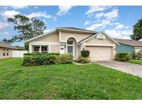 Charming single-story home featuring a well-maintained lawn and inviting curb appeal at 1611 Sand Key Cir, Oviedo, FL 32765