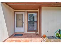Charming front entrance with decorative details and tiled porch, giving curb appeal at 5875 Talavera St, Orlando, FL 32807