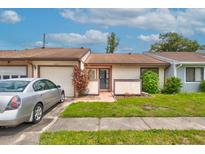 Charming single-story home with attached garage and well-maintained front yard at 5875 Talavera St, Orlando, FL 32807