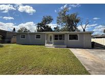 Charming single-story home with a well-manicured front lawn and inviting entrance at 2812 Dawley Ave, Orlando, FL 32806