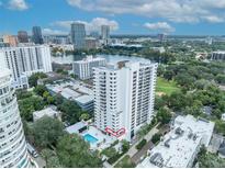 Aerial view of a high-rise building with a pool and city views at 530 E Central Blvd # 201, Orlando, FL 32801