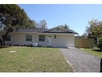 Charming single-story home with a well-maintained lawn and newly graveled driveway at 511 Reed Ne Ave, Oviedo, FL 32765