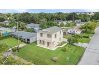 Charming two-story home with a well-manicured lawn and a view of the neighborhood at 821 E Story Rd, Winter Garden, FL 34787