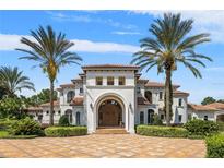 Impressive two-story home with tile roof and arched entryway at 1965 Lake Markham Preserve Trl, Sanford, FL 32771