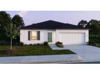 Beautiful single-story home featuring a two-car garage, dark roof, neutral paint, and landscaping at 1608 Jefferson Dr, Mount Dora, FL 32757