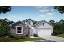 Charming single-story home featuring stone accents, neutral colors, a two-car garage, and professionally landscaped yard at 1685 Andover Ridge Dr, Deland, FL 32720