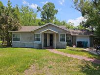 Charming one-story home with a well-maintained lawn at 3408 Lewis Ct, Orlando, FL 32805