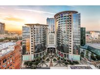 Stunning high-rise condo building boasting modern architecture, sleek glass facade, and luxurious urban living at 155 S Court Ave # 2710, Orlando, FL 32801