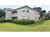 Building exterior showcasing landscaping and building number 570 at 570 Cranes Way # 248, Altamonte Springs, FL 32701