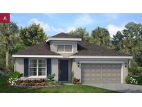 Charming single-Gathering home featuring a well-manicured lawn and a two-car garage at 2253 Sirena Ln, Mount Dora, FL 32757