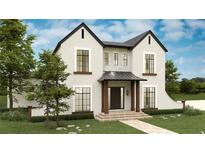 Charming two-story home with stone accents, landscaped yard, and welcoming front porch at 110 W Railway Ave, Oakland, FL 34760