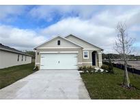 Single-story home with attached garage and landscaping at 3503 Fort Mellon Ln, Sanford, FL 32773