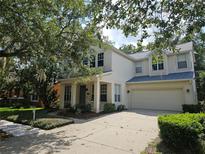 Charming two-story home with a manicured lawn and a spacious two-car garage at 226 W Tarrington Dr, Deland, FL 32724
