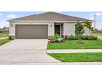 Charming one-story home with a well-manicured lawn and inviting curb appeal at 2676 Hancock Crossing Dr, Bartow, FL 33830