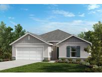 Charming single-Gathering home featuring a two-car garage, well-maintained lawn, and lovely landscaping at 2812 Gabion St, Bartow, FL 33830