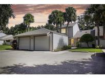 Two-car garage and front yard of charming townhome at 543 Warrenton Rd # 543, Winter Park, FL 32792