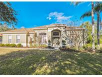 Single-story home with attractive landscaping and a welcoming front entrance at 9868 Montclair Cir, Apopka, FL 32703