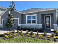 Charming single-Gathering home with a well-maintained front yard and gray exterior at 1173 Basalt Ln, Sanford, FL 32771