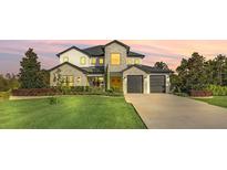 Stunning two-story home with a manicured lawn, stone accents, and a two-car garage at 4001 Ainsley Ave, Orlando, FL 32833