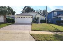 One-story house with attached garage and well-manicured lawn at 105 Fern Springs St, Debary, FL 32713